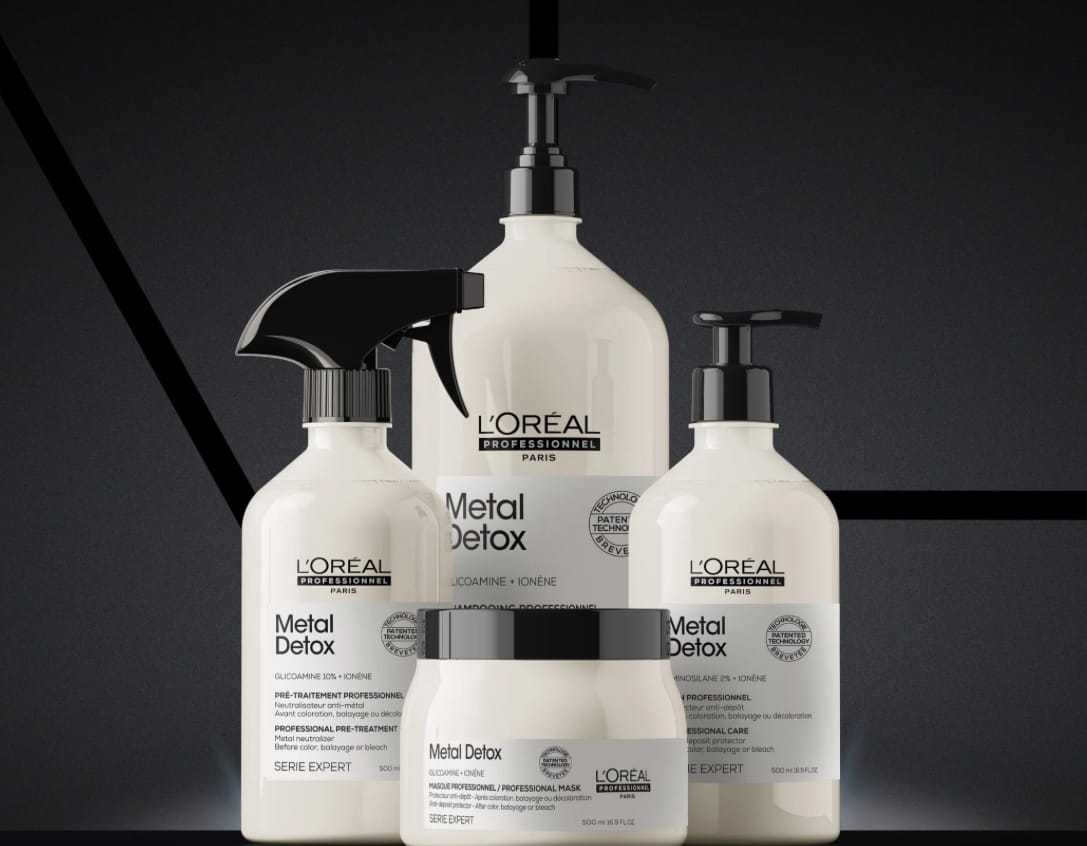 L'Oréal Professionnel Metal Detox haircare products against a dark geometric background.